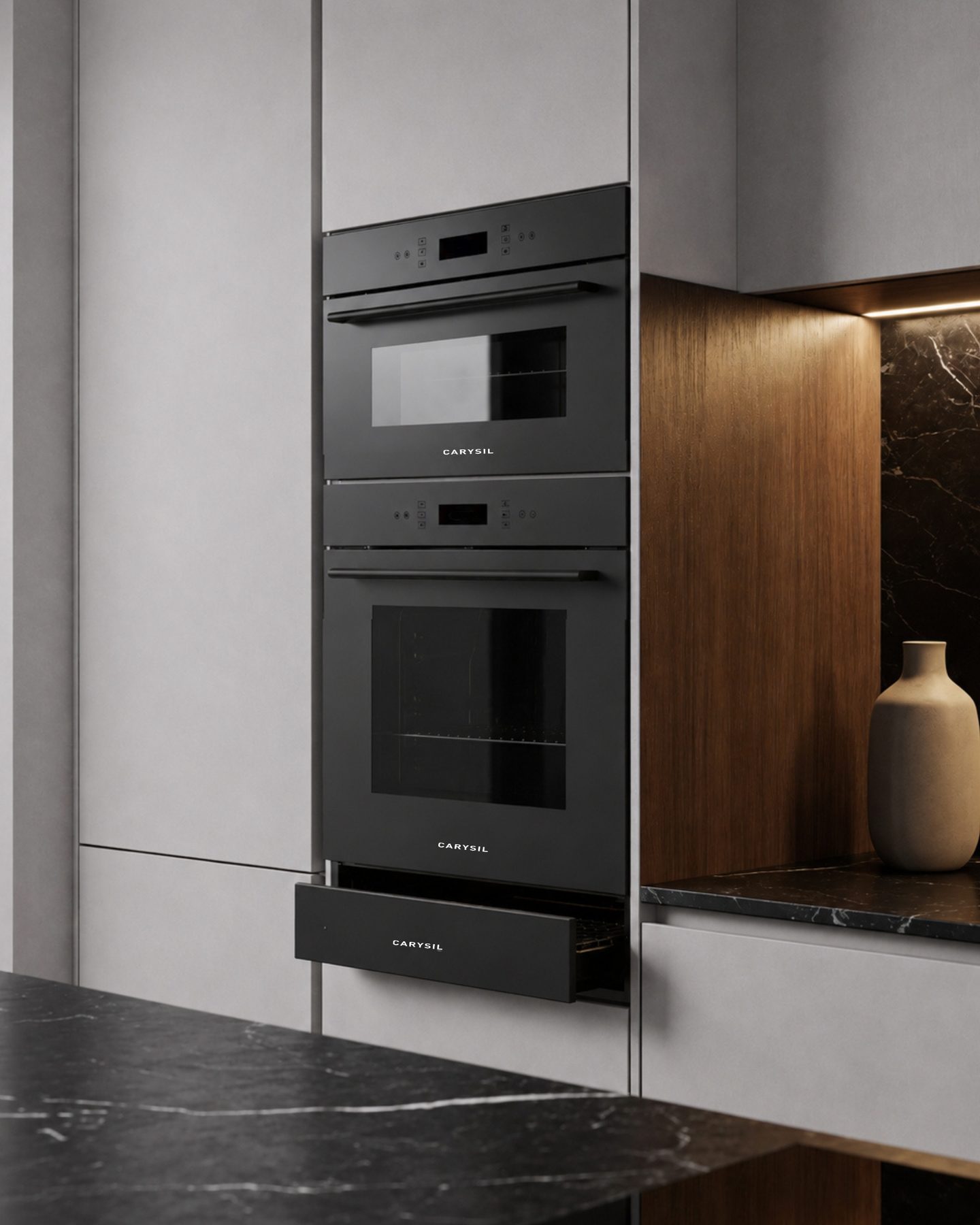 Carysil built-in oven column beside a marble worktop